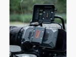 Rider removing Chigee AIO-6 display from BMW Quick-Release Module on adventure bike.